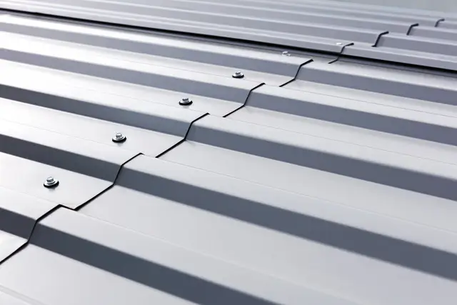 Metal roof installation in Austin, TX with modern standing seam panels